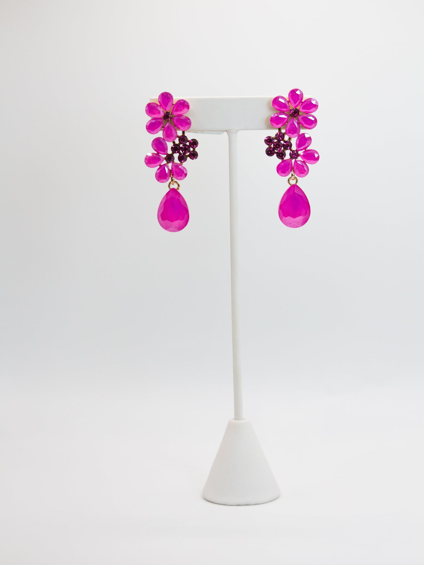 ARETES DE FLORES FUSIA